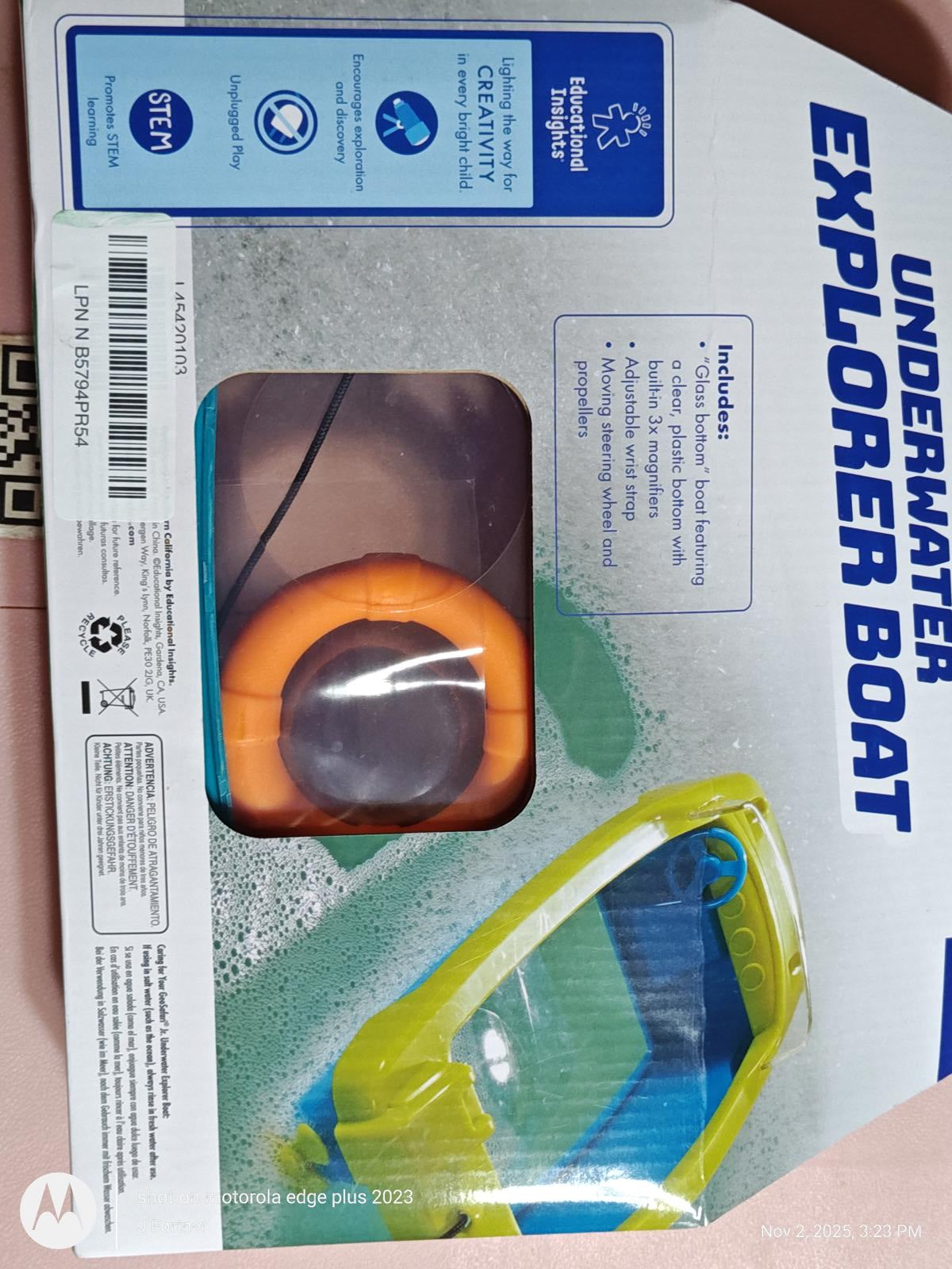Underwater Explorer Boat with orange flotation ring and blue hull for aquatic adventures.