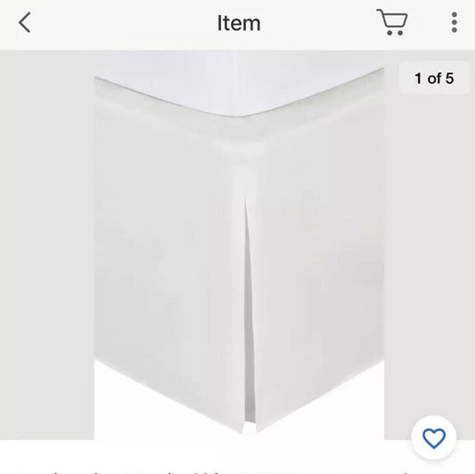 White bed skirt with pleated design for a clean look.