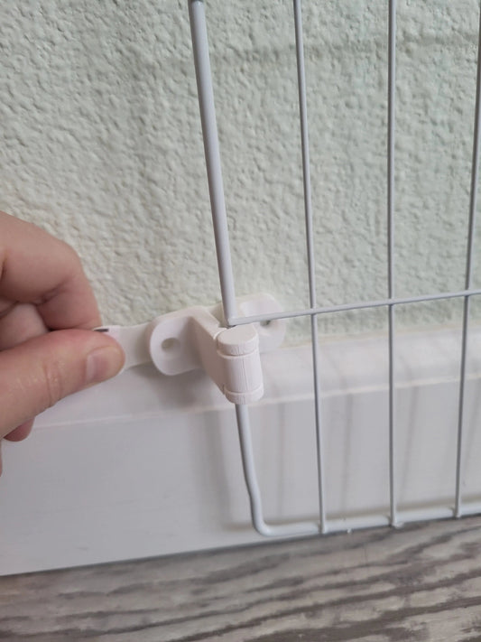 White wire shelf bracket being attached to a wall for secure shelving.