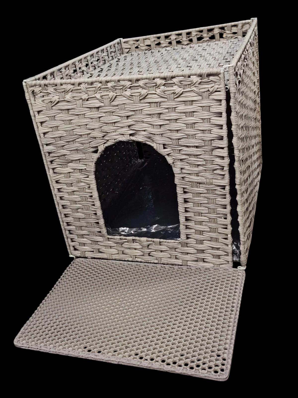 Woven cat house with an entrance and removable mat, perfect for pet comfort.