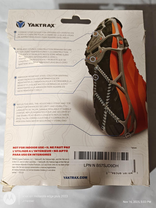 Yaktrax traction device for outdoor use, featuring a durable rubber sole and metal spikes for grip.