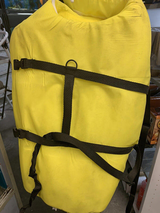 Yellow waterproof dry bag with black straps for outdoor adventures.