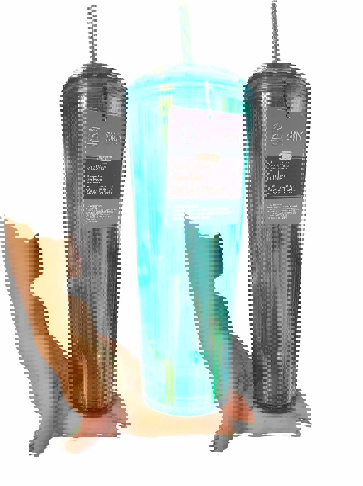 Zinny double-walled tumbler in teal color, 24 oz capacity, held in a hand.