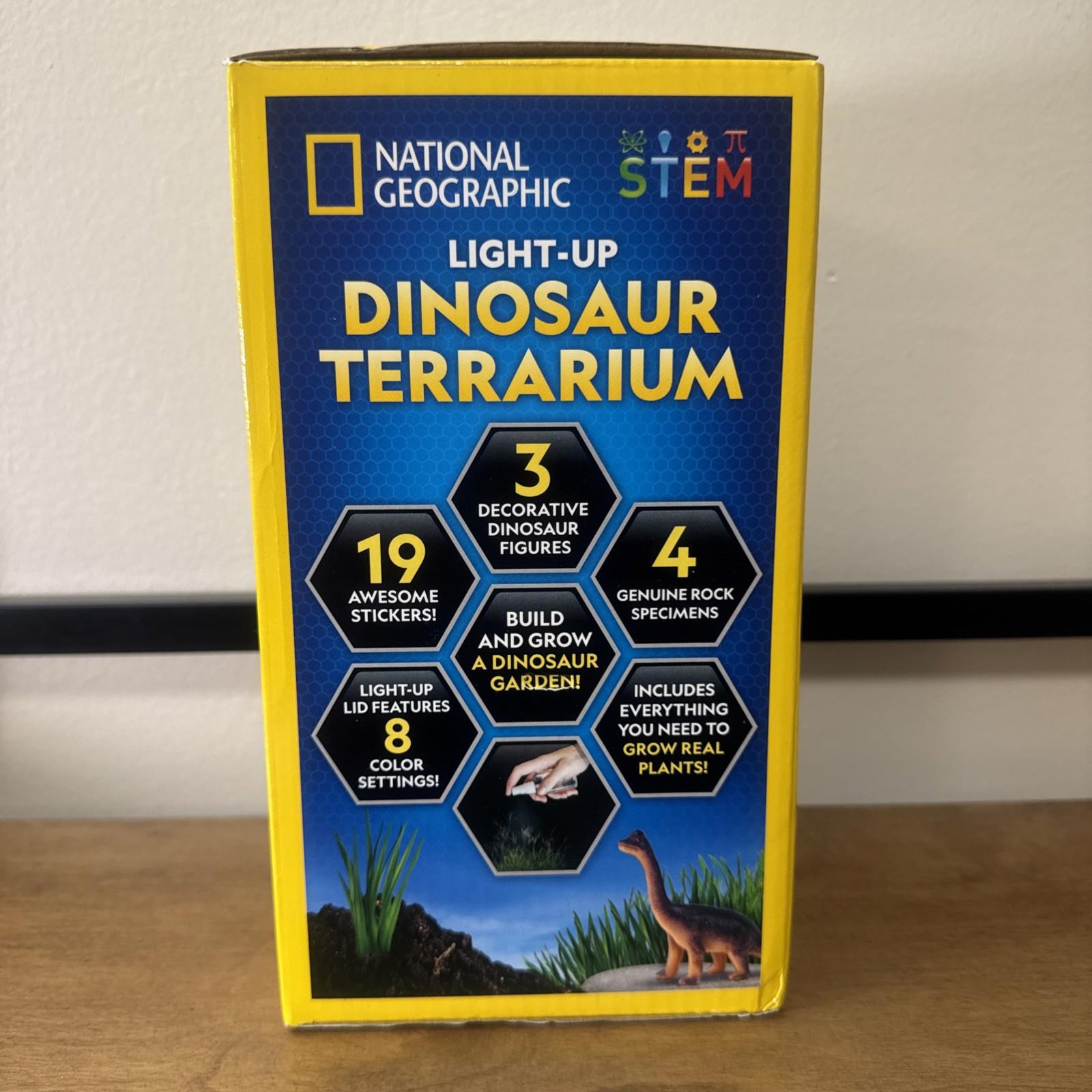 National Geographic Light-Up Dinosaur Terrarium with decorative figures and color-changing features.