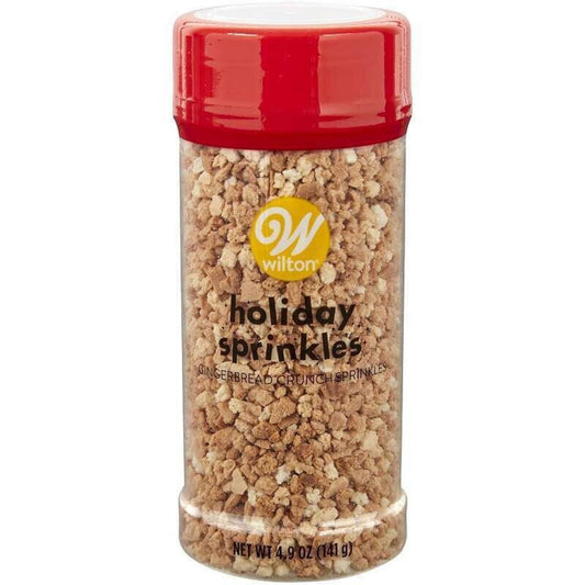 Wilton holiday sprinkles in a clear container with a red lid, perfect for festive baking.