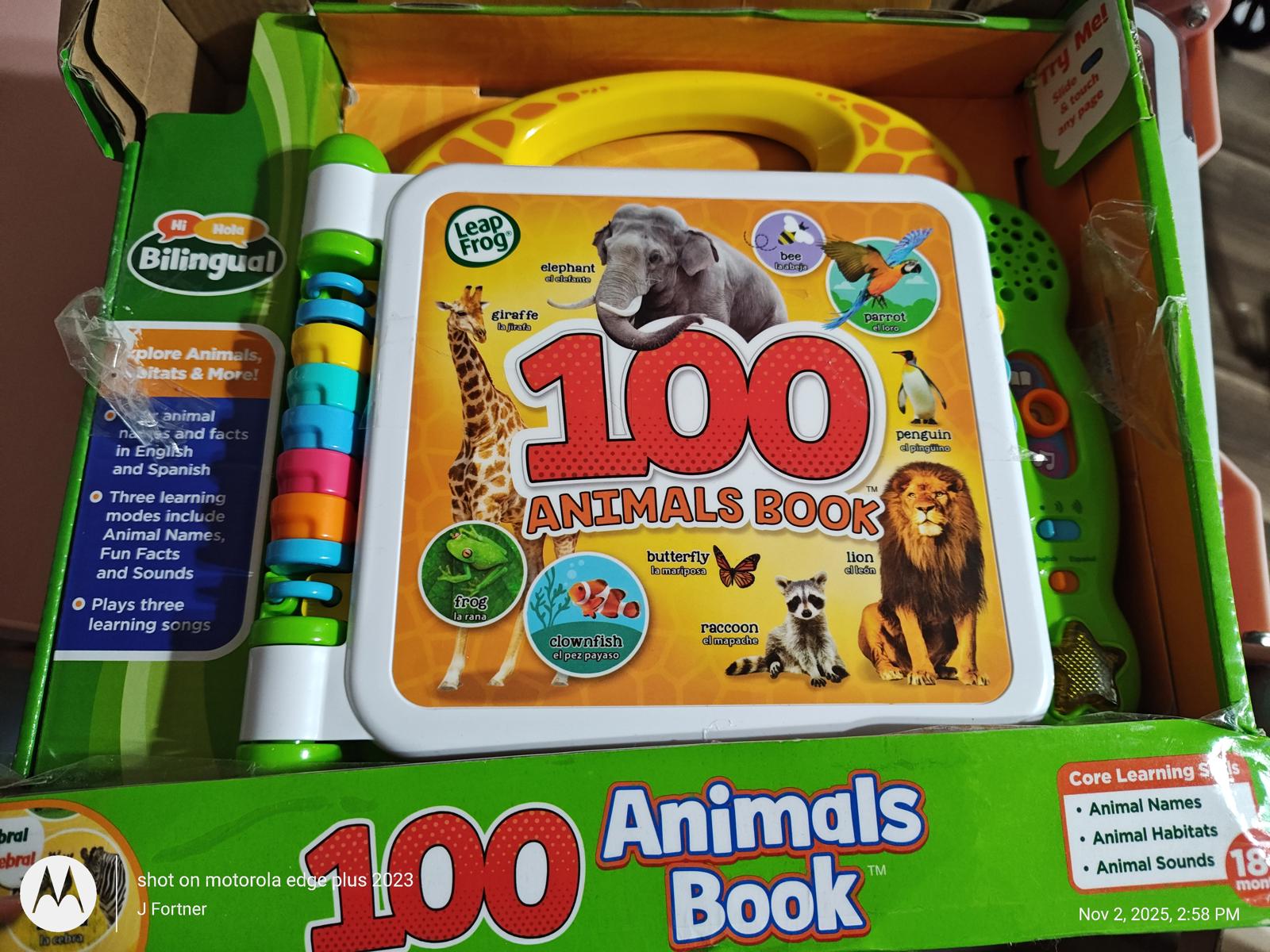 100 Animals Book featuring colorful illustrations and interactive features for learning about animals.