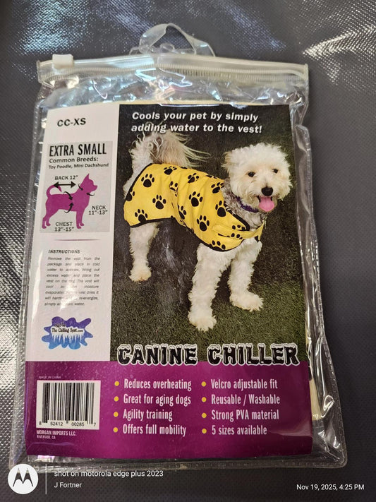 Canine Chiller dog vest in yellow with black paw prints, designed to cool pets by adding water.