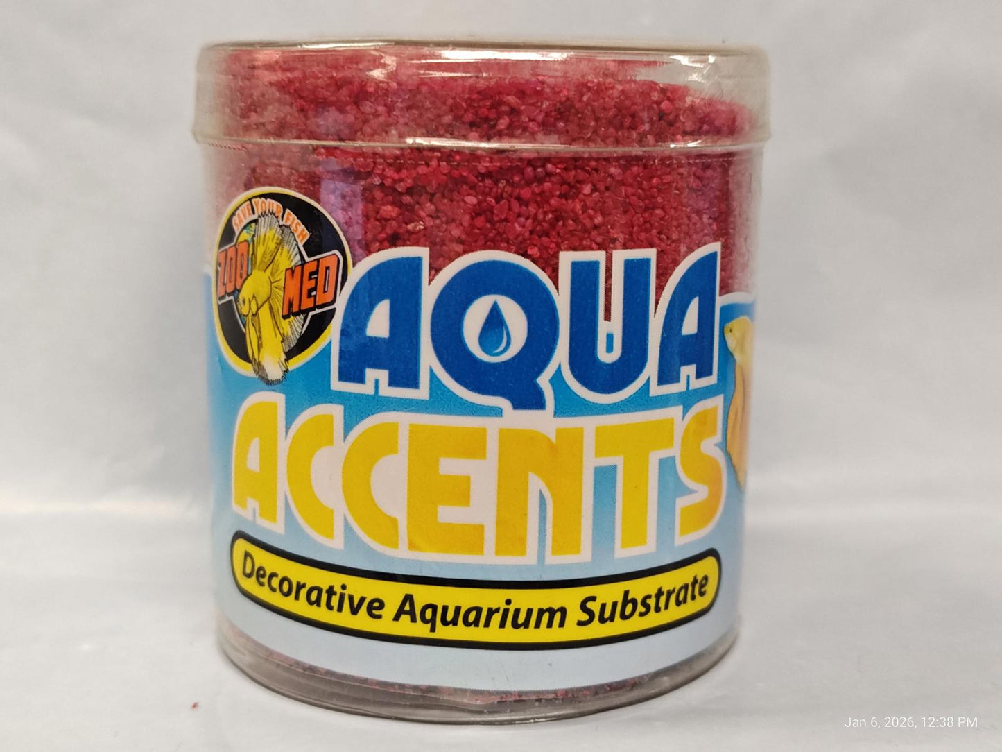 Aqua Accents decorative aquarium substrate in a clear container with red granules.
