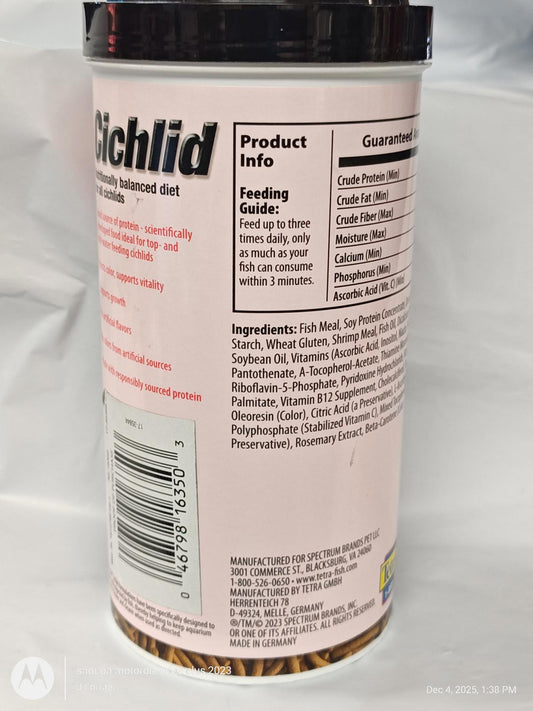 Cichlid fish food container with detailed feeding guide and ingredients list.