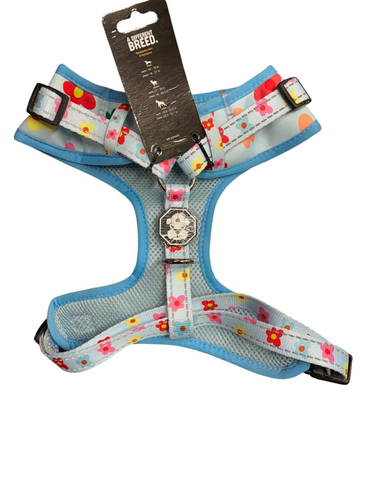Floral Dog Harness featuring a light blue mesh design with colorful flowers and adjustable straps.
