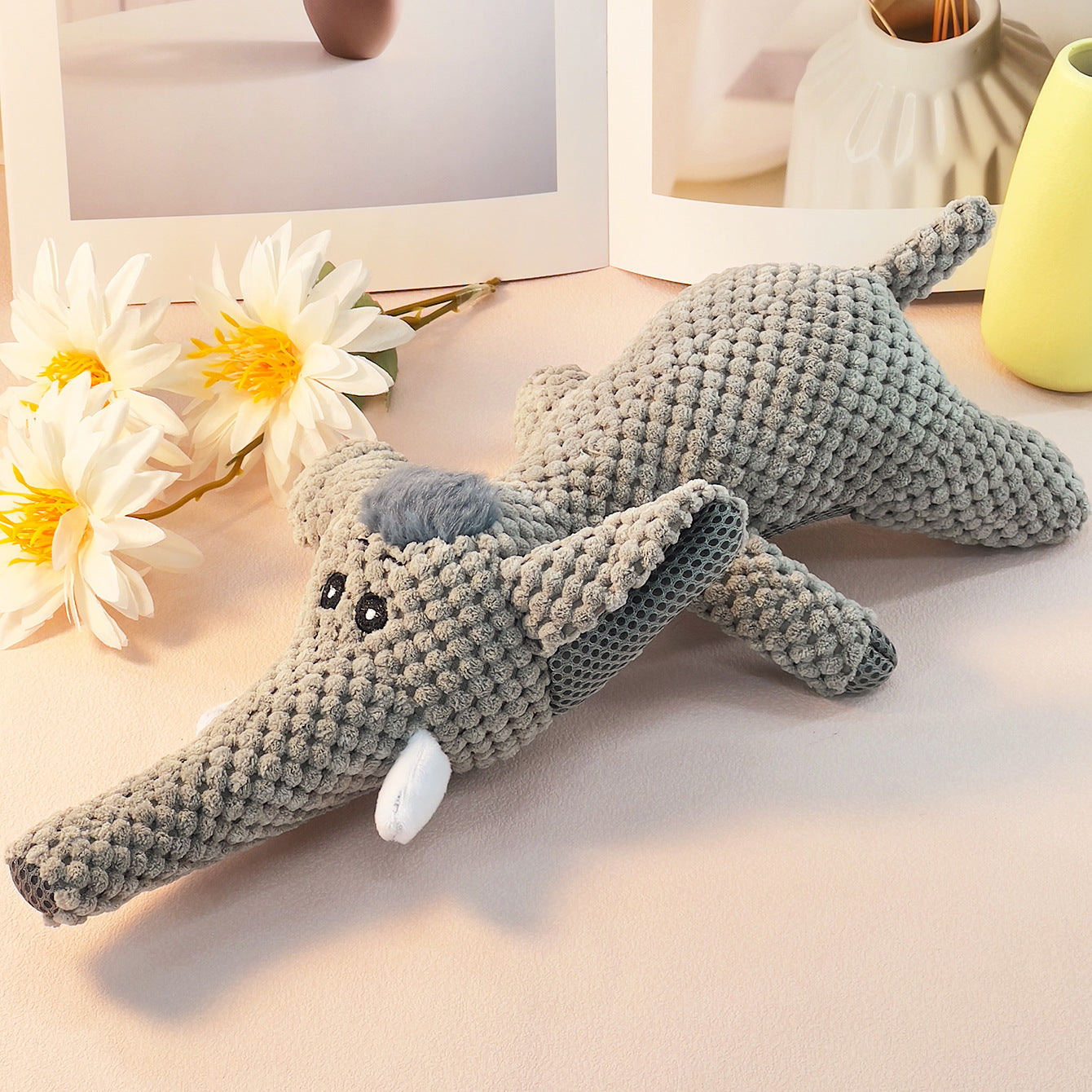 Gray Elephant Plush Toy with textured fabric and cute features.
