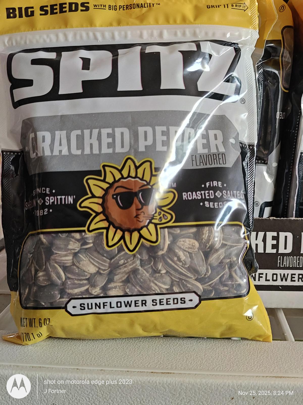 Spitz Cracked Pepper flavored sunflower seeds in a clear bag with a sunflower logo.