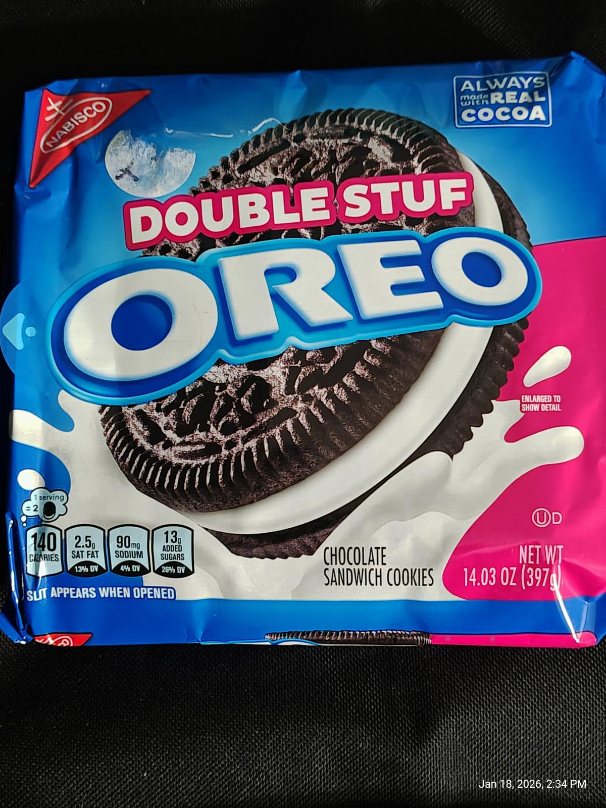 Double Stuf Oreo cookies with chocolate sandwich and creamy filling in blue packaging.