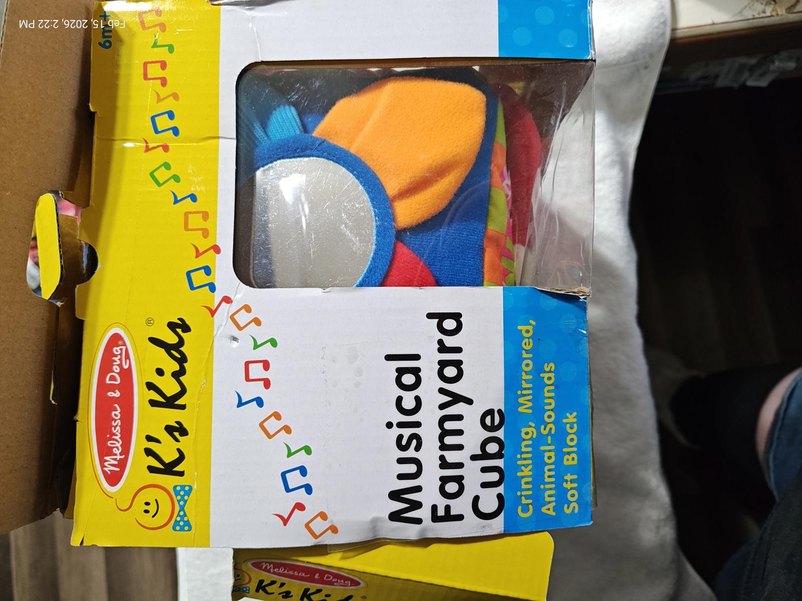Musical Farmyard Cube features colorful design with mirrors and sounds for interactive play.