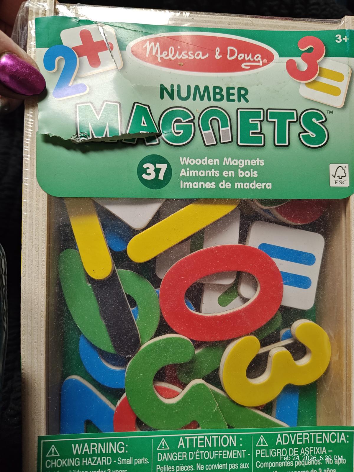 Melissa & Doug Number Magnets set featuring colorful wooden numbers and letters for educational play.