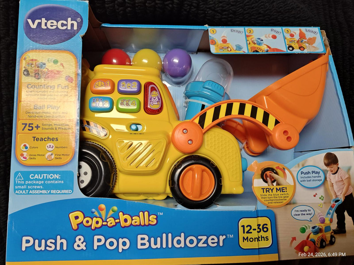 VTech Pop-a-Balls Push & Pop Bulldozer with colorful balls and interactive buttons.