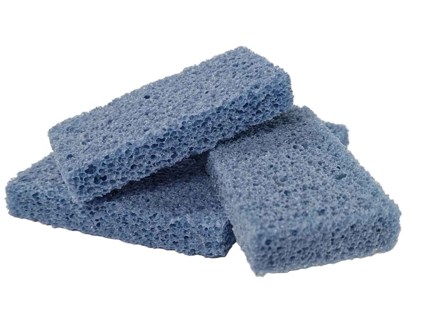 Three blue sponges stacked on a textured white surface