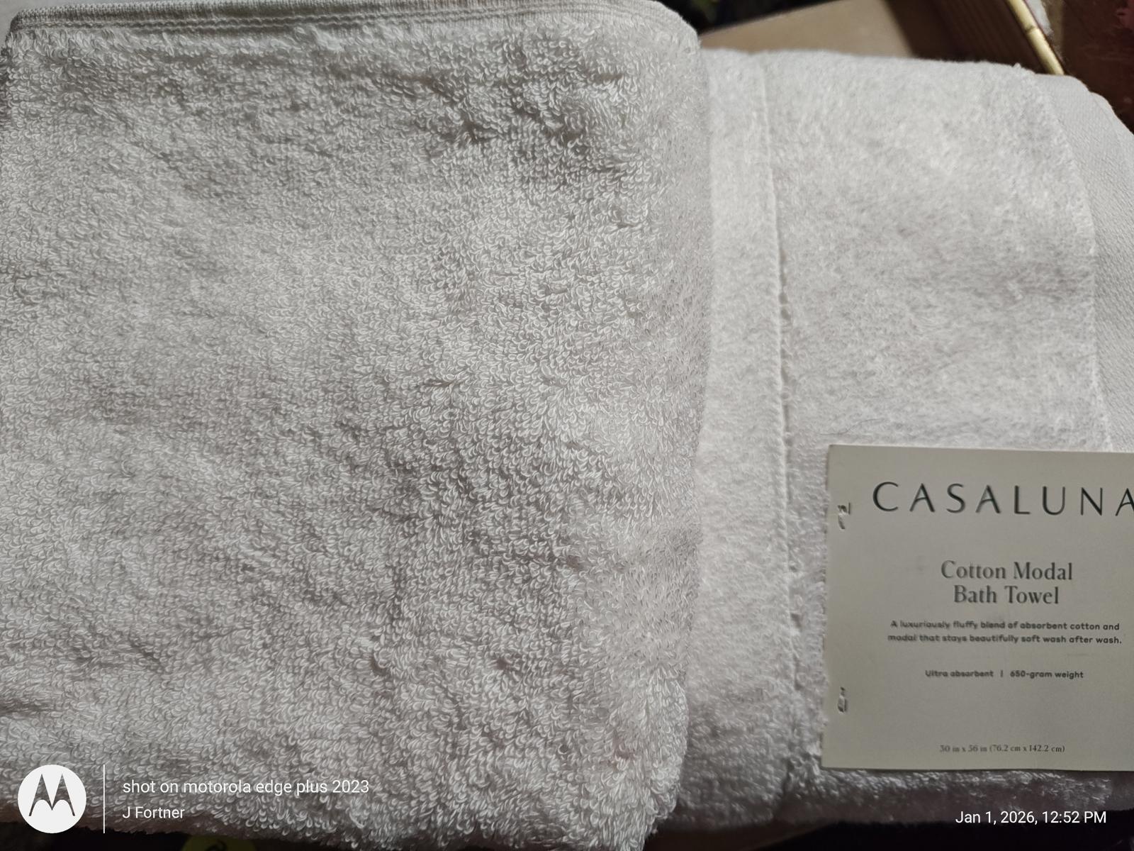 Casaluna cotton modal bath towel in soft white color, showcasing plush texture and label.
