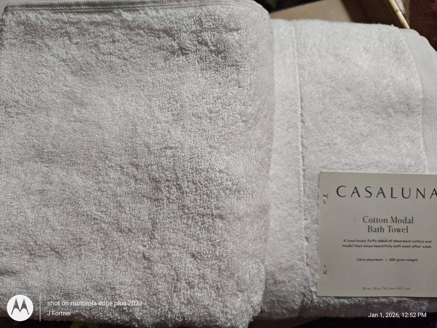 Casaluna cotton modal bath towel in soft white color, showcasing plush texture and label.