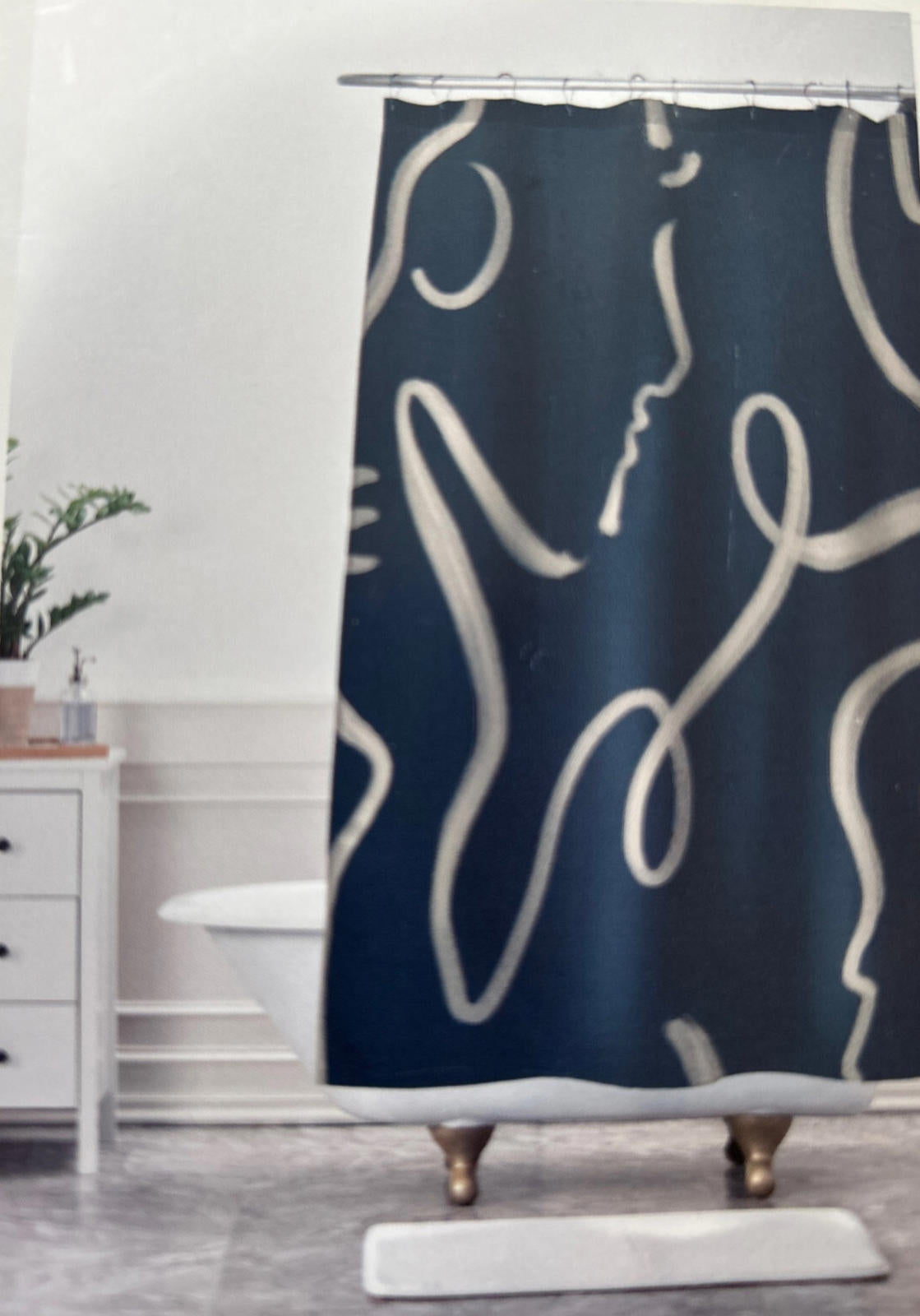Abstract Line Art Shower Curtain featuring a dark blue background with white line drawings.