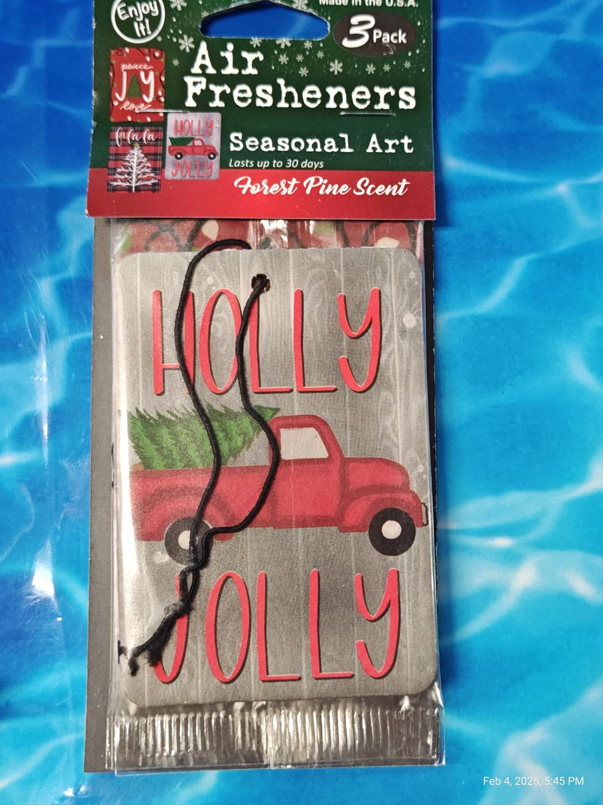 Air Fresheners featuring a red truck with a Christmas tree and 'Holly Jolly' text, perfect for seasonal decor.