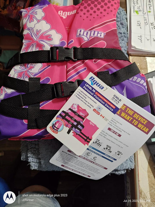 Aqua pink floral life jacket featuring adjustable straps and safety information tag.