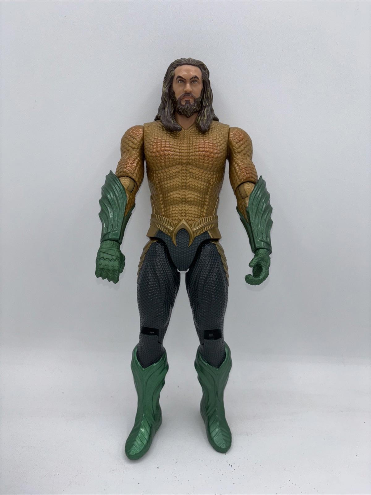 Aquaman action figure with detailed armor and green boots, standing upright.