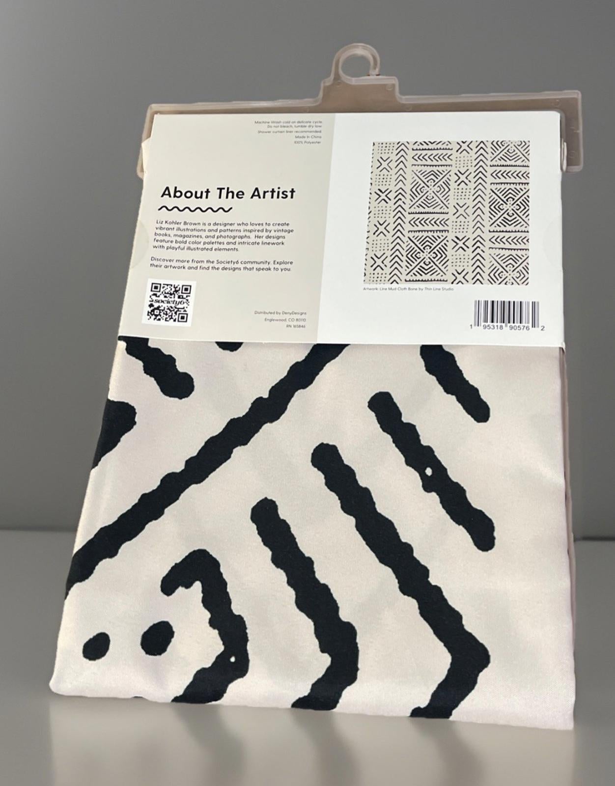 Artist's canvas featuring abstract black and white patterns, showcasing unique design elements.
