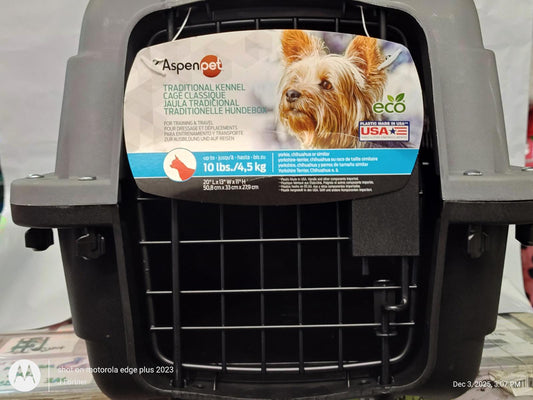 Aspen Pet traditional pet carrier with eco-friendly materials and a secure metal door.