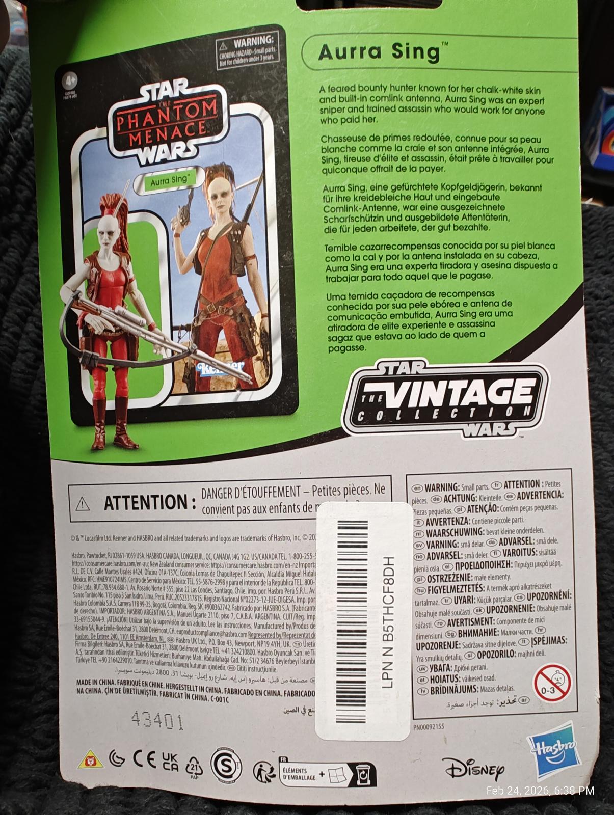 Aura Sing action figure from Star Wars: The Phantom Menace, featuring detailed design and packaging.