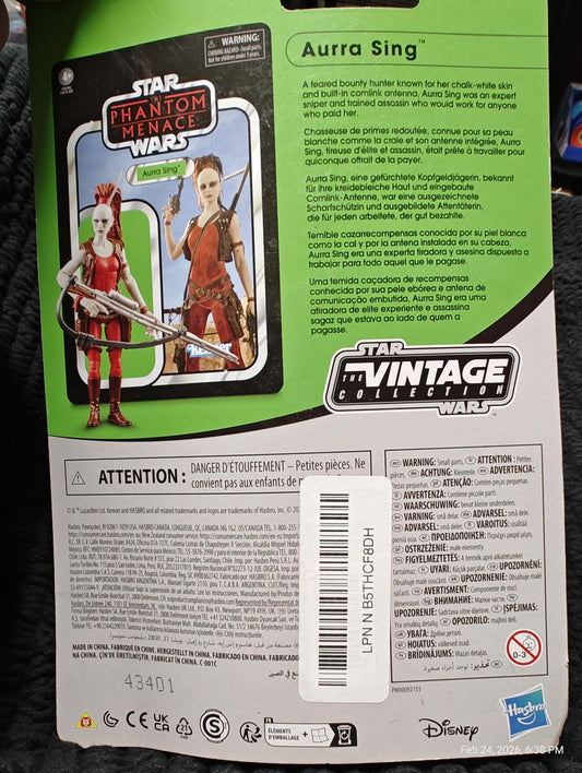 Aura Sing action figure from Star Wars: The Phantom Menace, featuring detailed design and packaging.