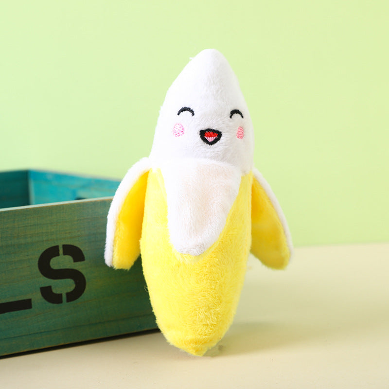 Banana plush toy with a smiling face and soft yellow fabric.
