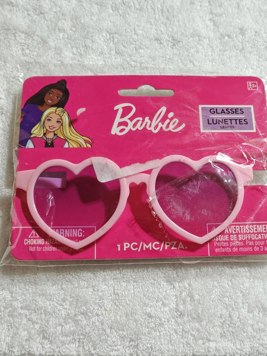 Barbie heart-shaped glasses in pink packaging with cartoon characters.