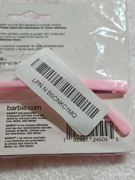 Barbie pink hair accessories set featuring styling tools and packaging details.