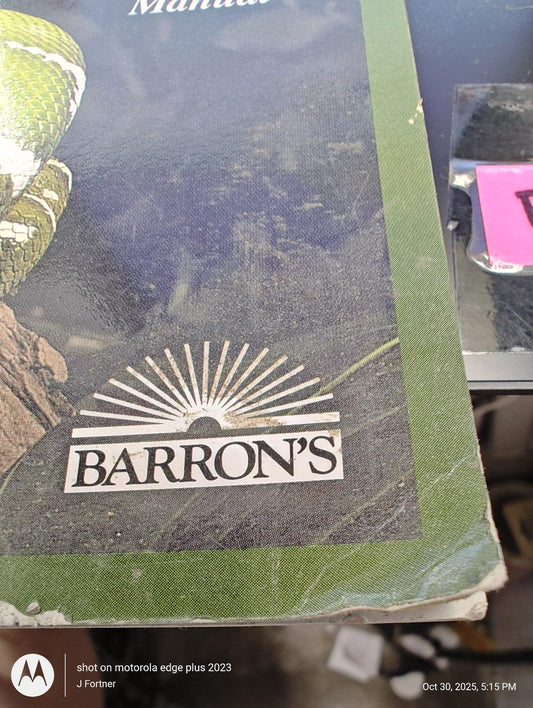 Barron's guidebook cover featuring a snake illustration and sunburst design.