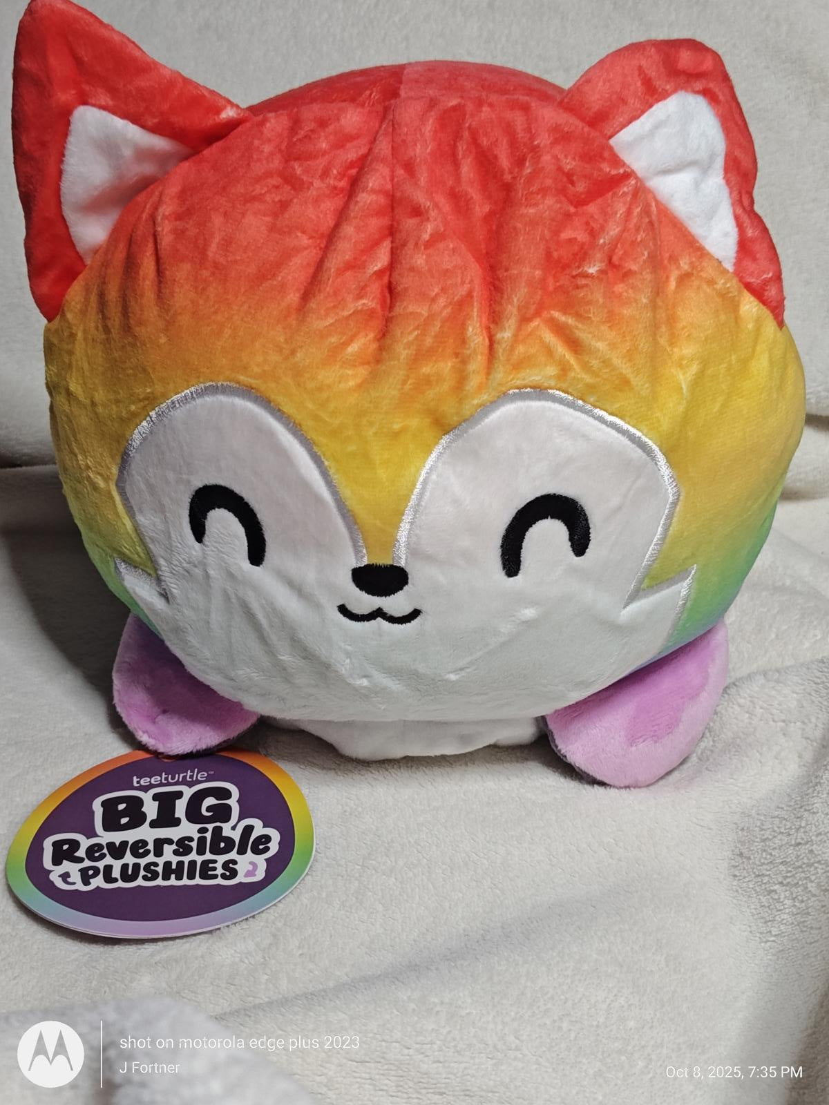 Big Reversible Plushies rainbow fox plush toy with a cute smiling face.