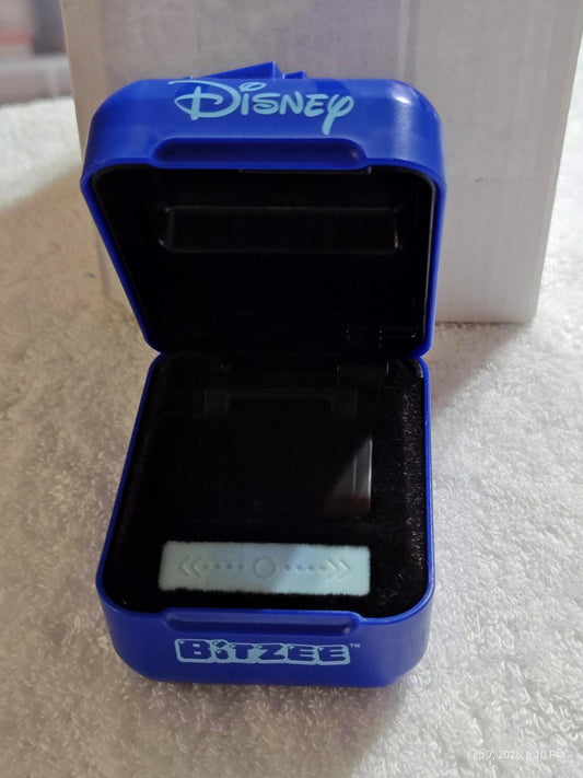Disney Bitzee toy in a blue case, featuring a small screen and buttons inside.