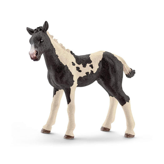Black and white pony figurine with detailed features and realistic design.