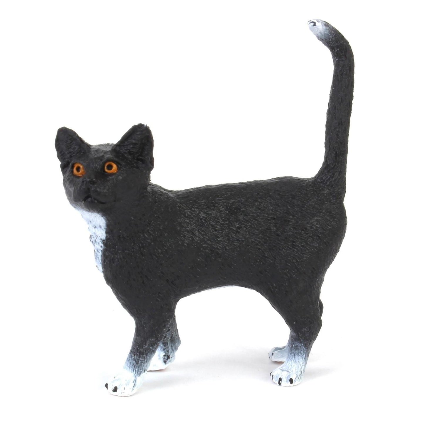Black Cat Figurine with orange eyes and white paws.