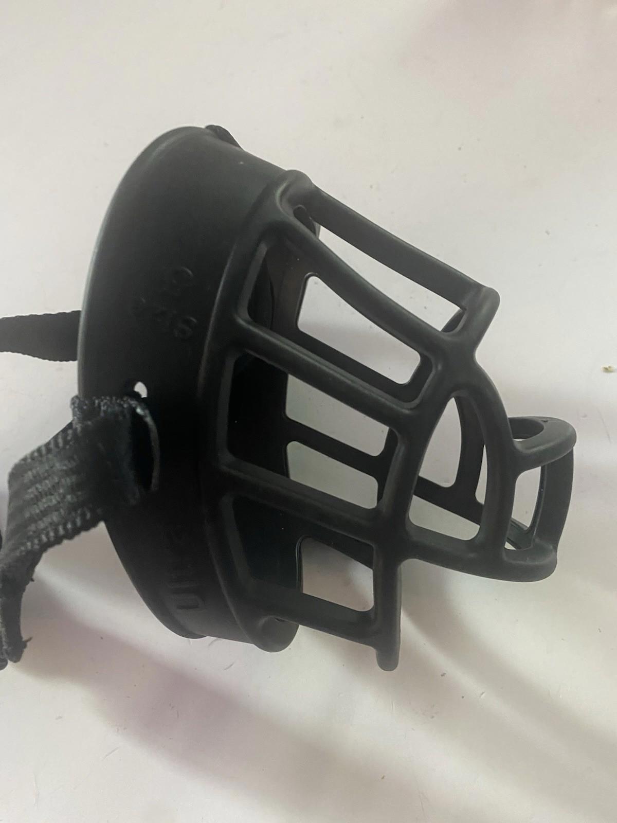 Dog muzzle for safety, featuring a black plastic design with ventilation holes.