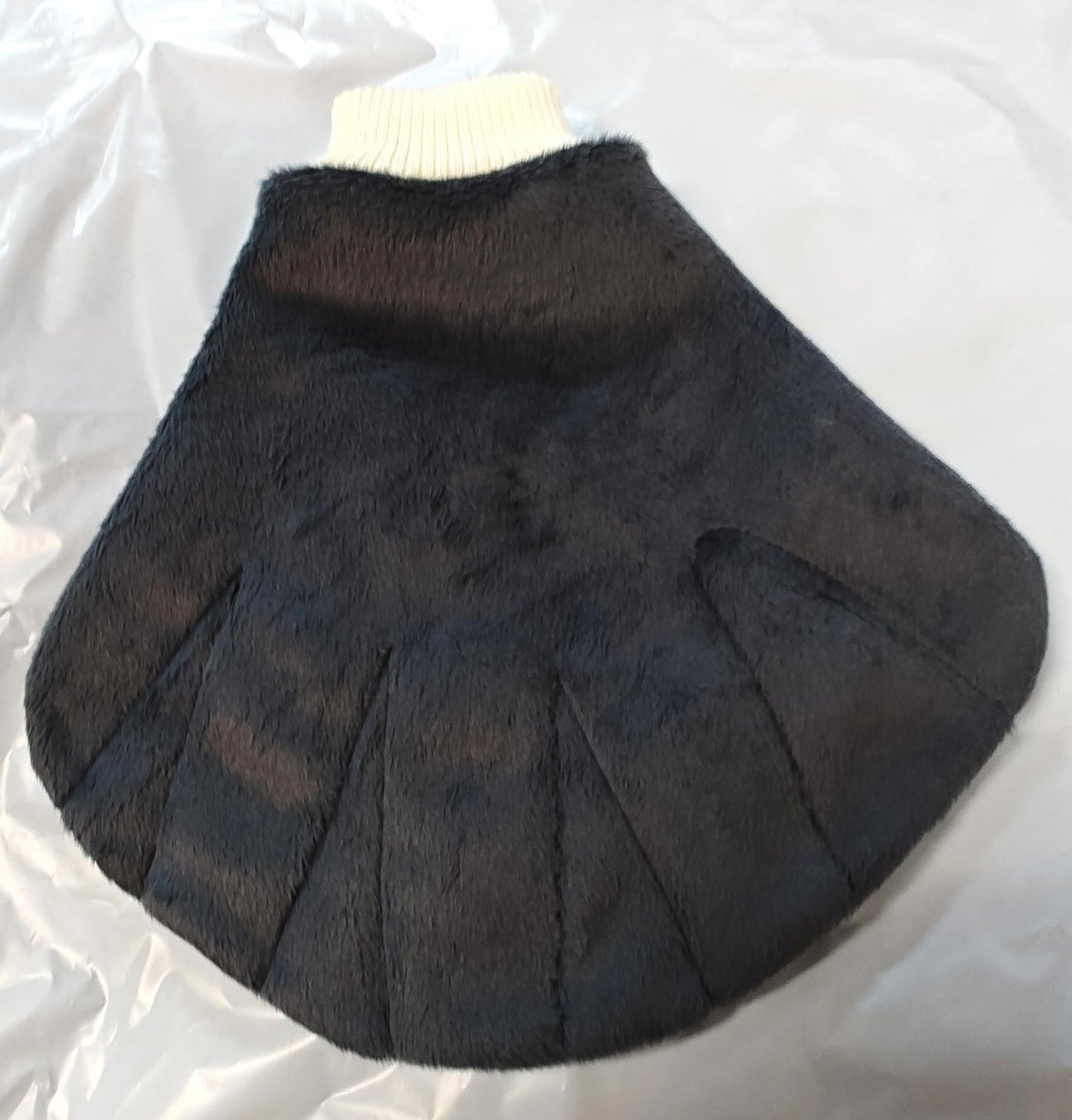 Black Faux Fur Cape with Pleated Design for Stylish Warmth.