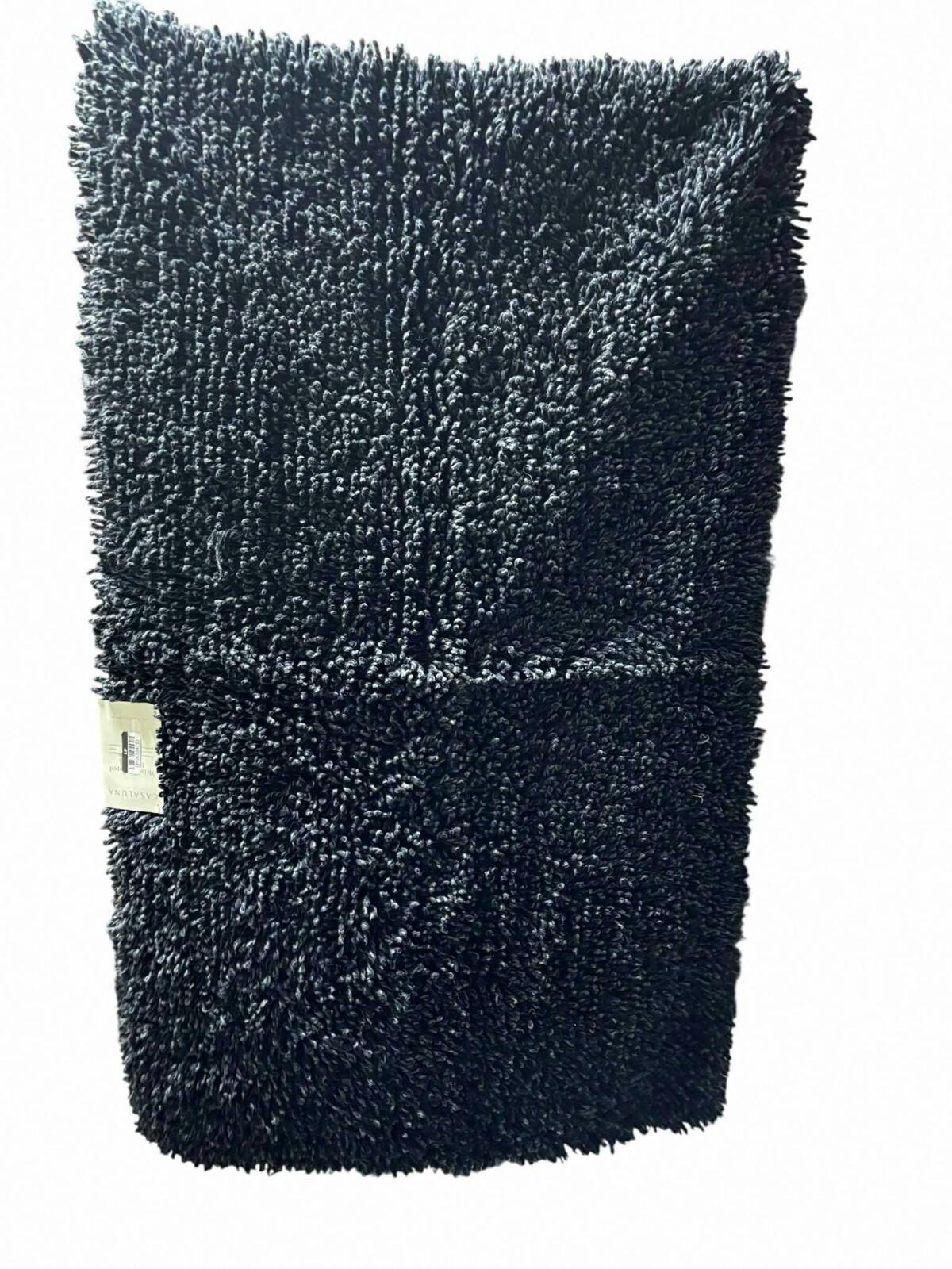 Black Microfiber Bath Mat with plush texture for comfort and absorbency.