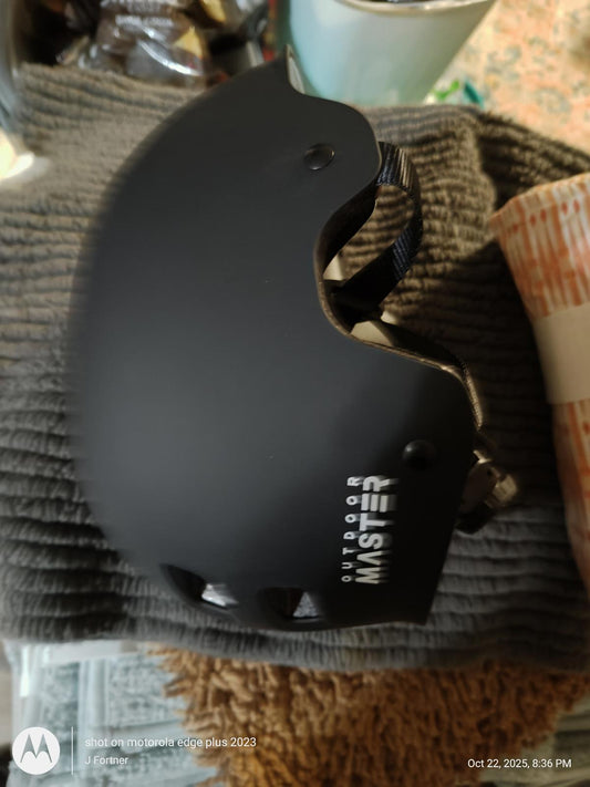Black skateboarding helmet with adjustable straps for safety.