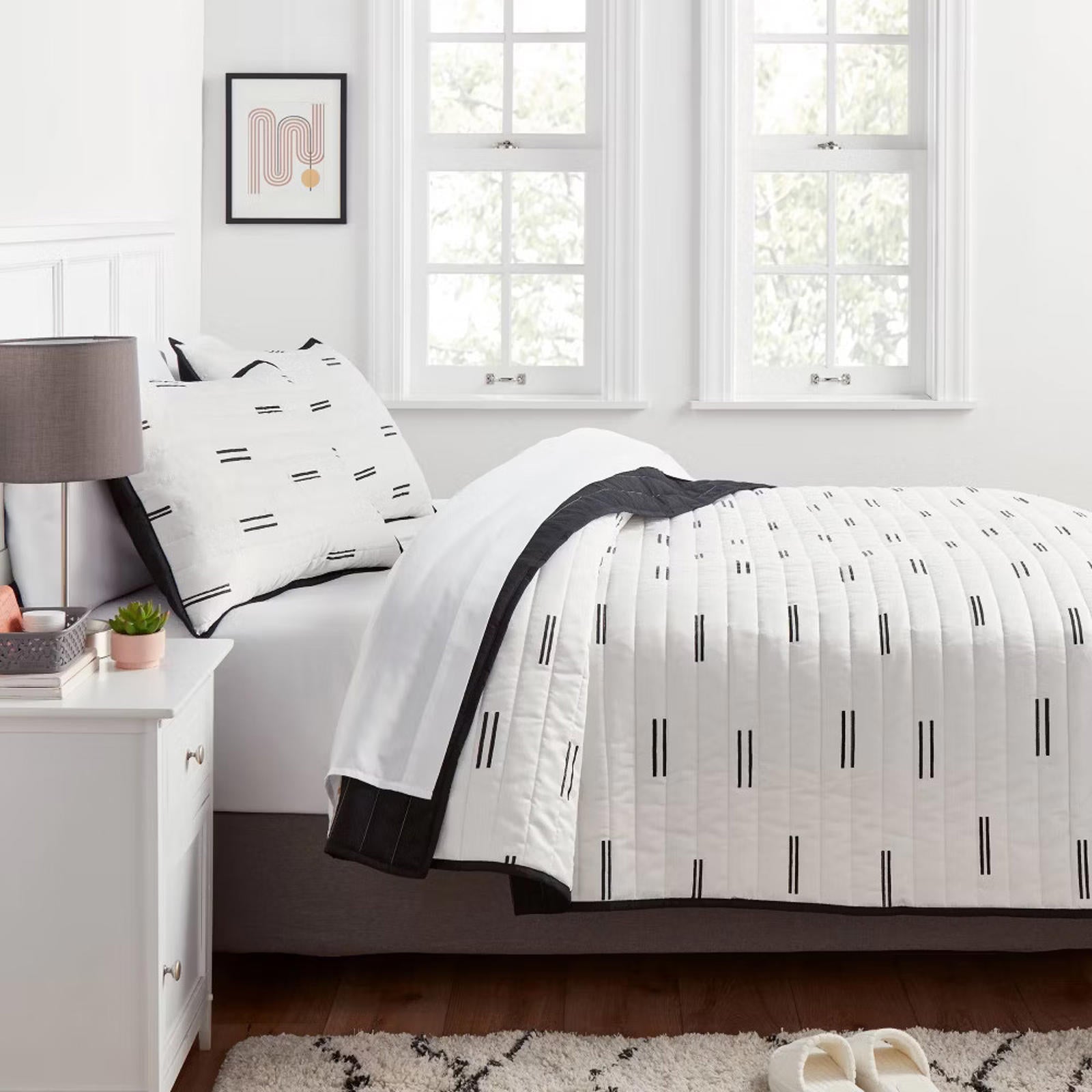 Black and white striped quilt set featuring a modern design, perfect for stylish bedroom decor.