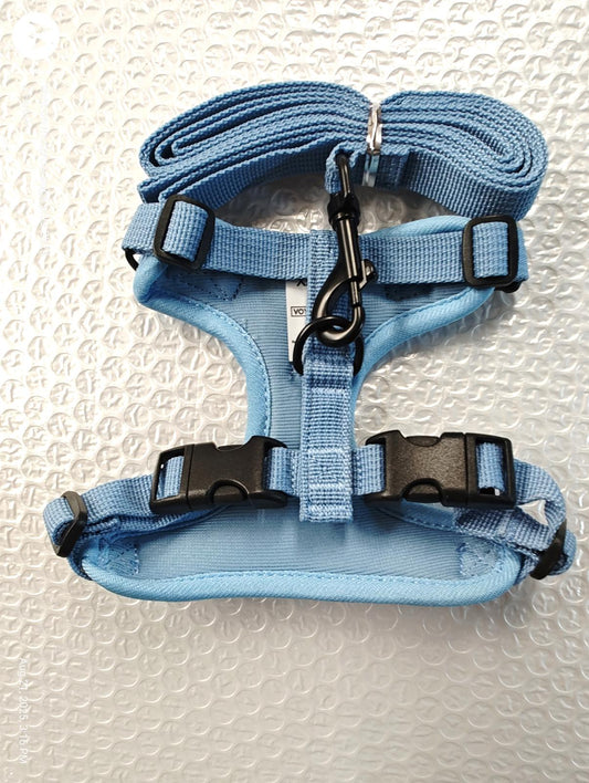 Blue dog harness featuring adjustable straps and a sturdy clip for secure fit.