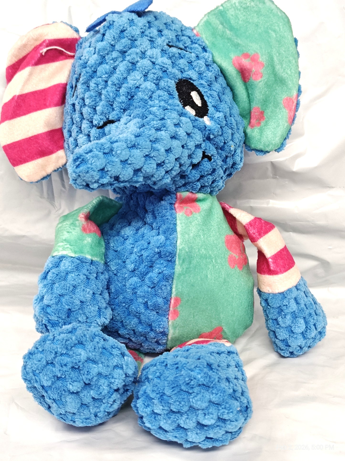 Blue Elephant Plush Toy with colorful floral and striped patterns.