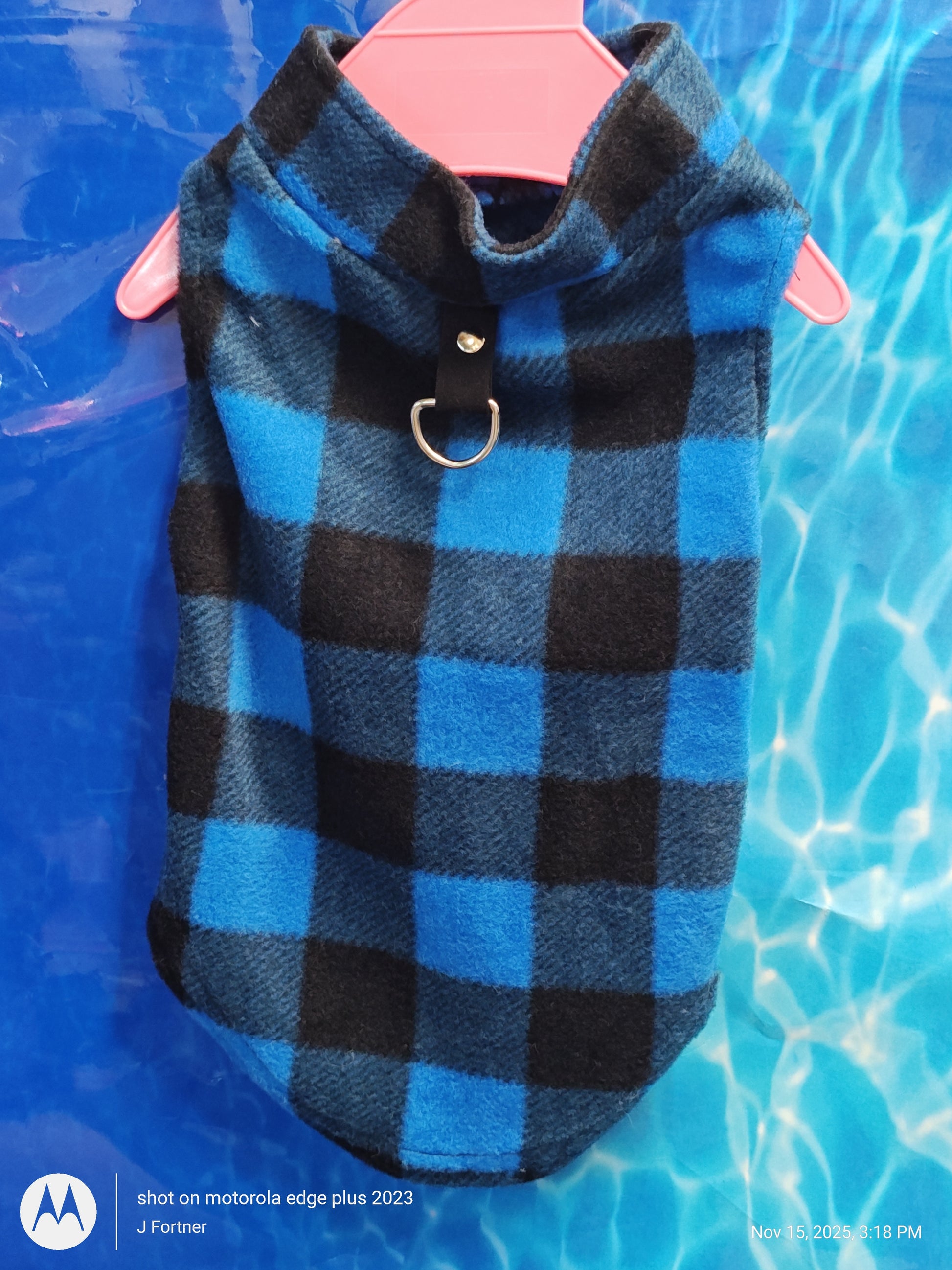 Plaid Dog Sweater in blue and black colors with a collar and D-ring for leash attachment.