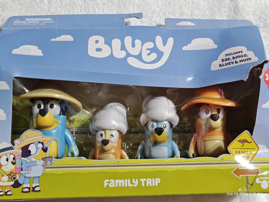 Bluey Family Trip toy set featuring Bluey, Bingo, and their parents in hats.