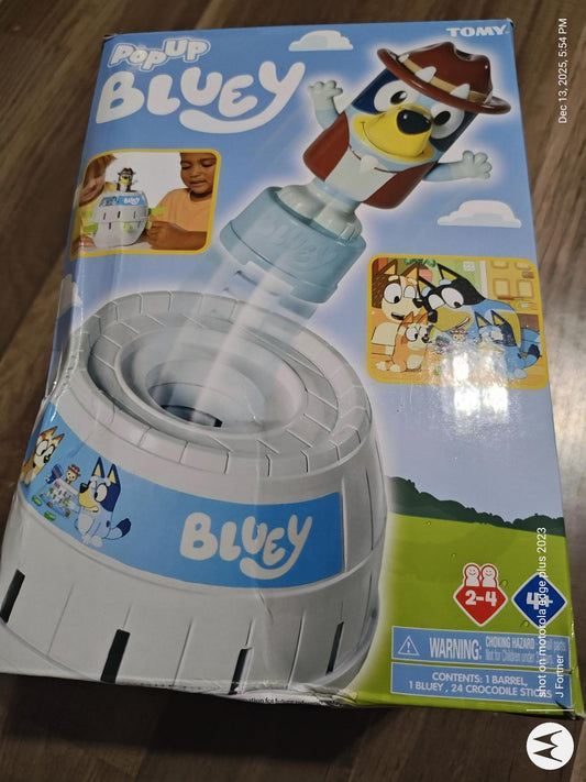 Pop Up Bluey toy featuring a playful design with Bluey character and colorful packaging.