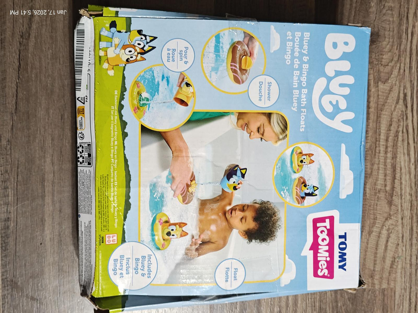 Bluey water play set by Tomy featuring colorful floating toys and a child enjoying bath time.